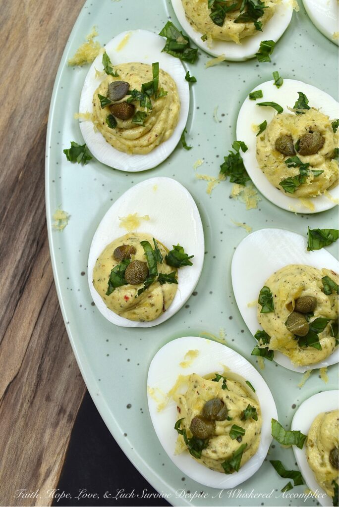 Deviled Eggs with Basil, Capers, & Lemon Zest - If you're looking to impress your guests with a delicious and unique appetizer, you can't go wrong with these deviled eggs. With the addition of fresh basil, capers, and lemon zest, they're sure to be the hit of the party. They're refreshing and have a hint of salt, with a touch of herby goodness that makes them simply irresistible. Your guests will be begging for the recipe.