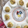 Fresh Basil & Sun-Dried Tomato Deviled Eggs - Fresh basil is the key ingredient to this simple yet extraordinary deviled egg recipe. When paired with very finely chopped sun-dried tomatoes, it immediately helps to make a winning impression on anyone lucky enough to scarf down one of these eggs before they all disappear. And yes, they will all disappear pretty quickly, so perhaps you might want to consider making a double batch.