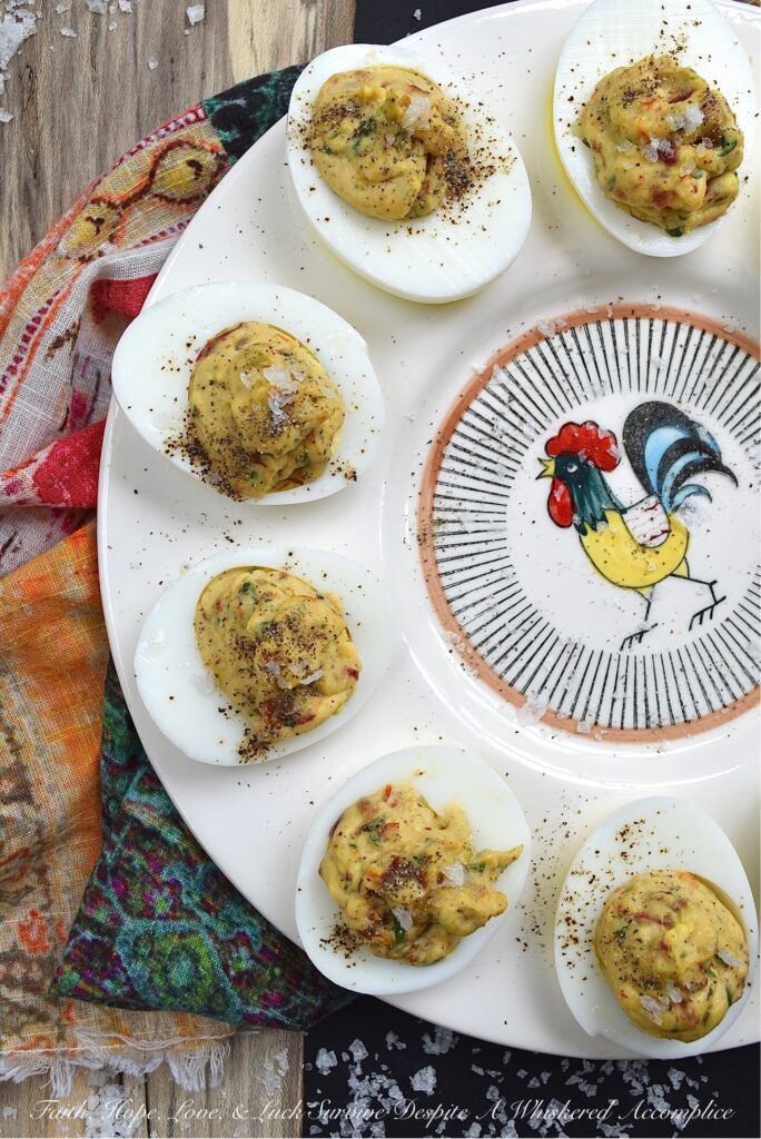 Fresh Basil & Sun-Dried Tomato Deviled Eggs - Fresh basil is the key ingredient to this simple yet extraordinary deviled egg recipe. When paired with very finely chopped sun-dried tomatoes, it immediately helps to make a winning impression on anyone lucky enough to scarf down one of these eggs before they all disappear. And yes, they will all disappear pretty quickly, so perhaps you might want to consider making a double batch.