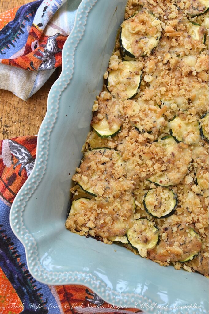 Zucchini & Orzo Pasta Baked Cheddar Casserole - This layered summer zucchini baked casserole with orzo pasta and cheddar cheese is a savory and delicious easy-to-make summer side dish. It's perfect for using up any extra zucchini you have from your garden, and it's a great crowd-pleaser for the whole family. The layers of pasta, zucchini, creamy sauce, and cheddar cheese make for a flavorful and satisfying dish. And to top it off, there's a crunchy butter cracker topping that adds just the right amount of texture to this tender zucchini and pasta baked casserole.
