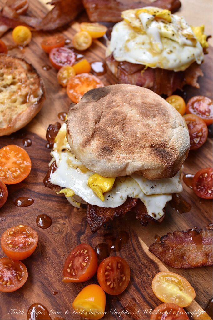 Whiskey Maple Butter Bacon, Egg, & Cheese - When it comes to a bacon, egg, and cheese sandwich, there's just something about the combination of salty bacon, gooey cheese, and a perfectly cooked egg that always hits the spot. However, when you drizzle the same breakfast sandwich with maple whiskey butter sauce, it instantly takes the whole sandwich to a whole new level. It's the perfect early morning combination of savory and sweet.