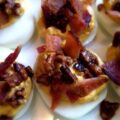 Pumpkin Deviled Eggs - If you're looking for a truly unique deviled egg recipe to impress your friends, this is the one. These deviled eggs are flavored with pumpkin puree, ground coriander, and traditional deviled egg seasonings. Then these eggs are topped with toasted sweet buttery pecans and crispy chopped bacon. Pumpkin deviled eggs may sound strange, however, they're about to change your entire world with their delicious flavor.