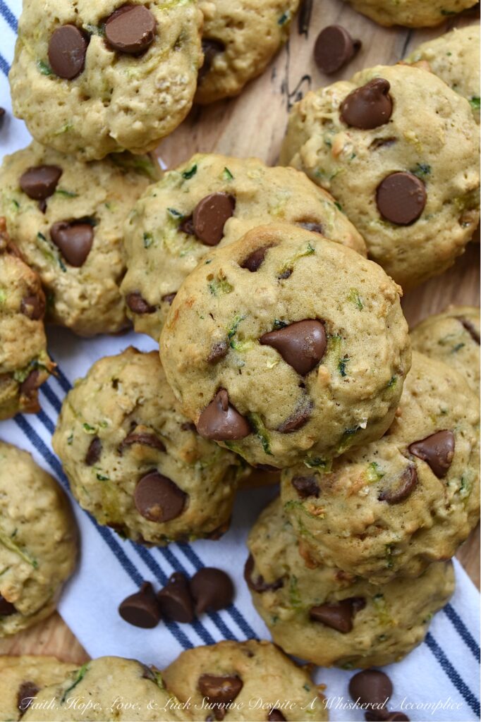 Soft Zucchini Milk Chocolate Chip Cookies - If you're looking for a delicious recipe to help you make the most of your summer zucchini harvest, this is the recipe for you. These soft, pillowy zucchini cookies made with milk chocolate chips couldn't be more perfect. The moist grated zucchini adds a delightful texture and flavor to these cookies. Whether you're looking for a sweet dessert to bring to a picnic, barbecue, or party or perhaps just a treat for yourself, these cookies are sure to be a hit.
