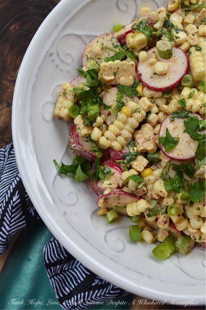Smoky Cilantro Creamy Corn & Radish Salad - The combination of flavors and textures in this creamy corn and radish vegetable salad is simply delicious. The smoky chili and cumin spices in the creamy mayonnaise-based cilantro dressing give this salad a nice kick, while the corn's sweetness and the sliced radishes' crunch provide a perfect flavor balance. This is a must-try summer vegetable side dish for when you're craving something fresh and flavorful, with a delightful crunchy texture.
