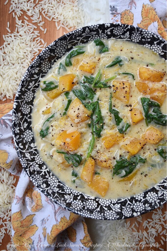 Creamy Parmesan Butternut Squash Rice Soup - This creamy one-pot soup recipe is so easy to make and requires very few ingredients. Butternut squash, jasmine rice, baby spinach, and parmesan cheese all come together to create a comforting, rich, and flavorful cheesy soup that's perfect for any chilly evening. And, the best part is, that it doesn't take much time to prepare, which means that this is the perfect cold weather weeknight meal.