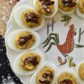 Sweet Chili Candied Pumpkin Seed Deviled Eggs - Deviled eggs are a classic holiday treat, and this version takes it up a notch with a creamy, flavorful chili powder seasoned filling, lightly sweetened with just a touch of honey. Topped with easy-to-make buttery roasted and candied pumpkin seeds and a touch of flaky sea salt, these deviled eggs are the perfect fall side dish or appetizer. They'll add a special touch to your holiday table or buffet and make a wonderful addition to your next gathering.