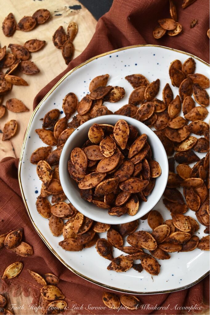 Buttery Chili Roasted Pumpkin Seeds - Fall is the perfect time of year to enjoy a seasonal snack with a hint of salt and a slightly spicy chili kick, so make sure you don't throw away your pumpkin seeds after you carve your pumpkins this year. After these pumpkin seeds are boiled in salted water they are then oven-roasted with melted butter, chili powder, and onion powder. Once they're finished baking, sprinkle the roasted pumpkin seeds with a bit of sea salt for the perfect savory nibble. Enjoy these pumpkin seeds as a snack during the fall months, or use them to garnish a comforting bowl of pumpkin soup or a fresh garden salad topped with dried cranberries and diced apples.