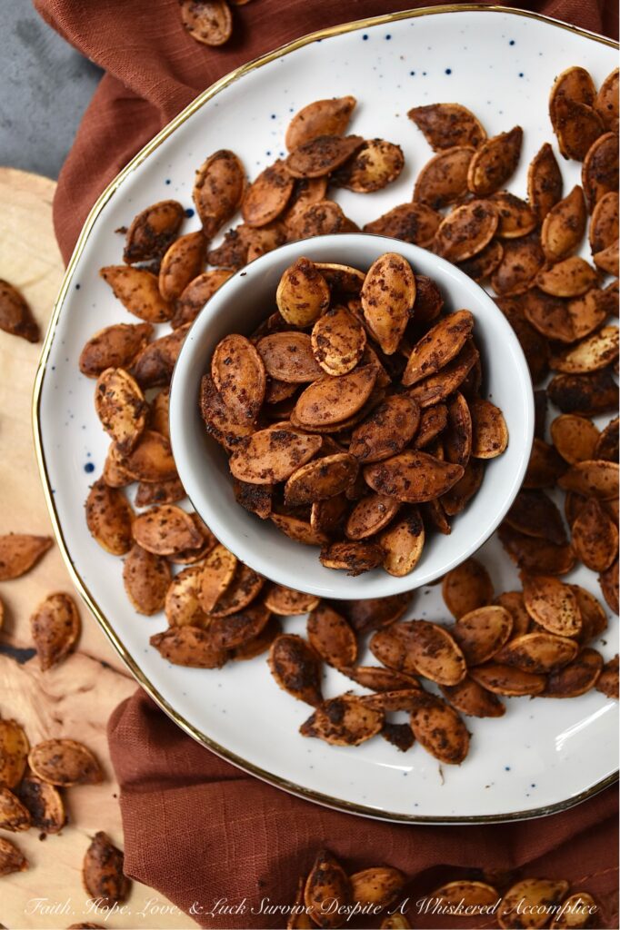 Buttery Chili Roasted Pumpkin Seeds - Fall is the perfect time of year to enjoy a seasonal snack with a hint of salt and a slightly spicy chili kick, so make sure you don't throw away your pumpkin seeds after you carve your pumpkins this year. After these pumpkin seeds are boiled in salted water they are then oven-roasted with melted butter, chili powder, and onion powder. Once they're finished baking, sprinkle the roasted pumpkin seeds with a bit of sea salt for the perfect savory nibble. Enjoy these pumpkin seeds as a snack during the fall months, or use them to garnish a comforting bowl of pumpkin soup or a fresh garden salad topped with dried cranberries and diced apples.