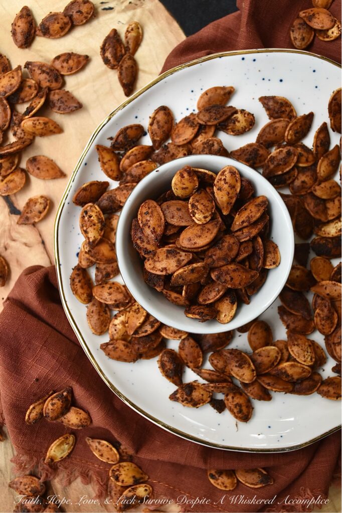 Buttery Chili Roasted Pumpkin Seeds - Fall is the perfect time of year to enjoy a seasonal snack with a hint of salt and a slightly spicy chili kick, so make sure you don't throw away your pumpkin seeds after you carve your pumpkins this year. After these pumpkin seeds are boiled in salted water they are then oven-roasted with melted butter, chili powder, and onion powder. Once they're finished baking, sprinkle the roasted pumpkin seeds with a bit of sea salt for the perfect savory nibble. Enjoy these pumpkin seeds as a snack during the fall months, or use them to garnish a comforting bowl of pumpkin soup or a fresh garden salad topped with dried cranberries and diced apples.
