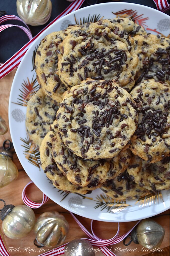 Ginger's Cherry Chocolate Chip Sprinkle Cookies - Chocolate chip cookies are everyone's favorite, and this cookie recipe is one that my mom, Ginger, would have loved at first bite. These delicious cookies are loaded with miniature semi-sweet chocolate chips, chocolate sprinkles, and dried sweetened cherries, making them the perfect combination of crunchy and chewy. If you're someone who loves chocolaty cookies with lots of texture, these are the cookies for you.