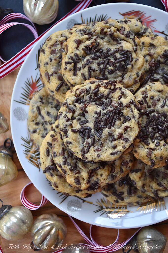 Ginger's Cherry Chocolate Chip Sprinkle Cookies - Chocolate chip cookies are everyone's favorite, and this cookie recipe is one that my mom, Ginger, would have loved at first bite. These delicious cookies are loaded with miniature semi-sweet chocolate chips, chocolate sprinkles, and dried sweetened cherries, making them the perfect combination of crunchy and chewy. If you're someone who loves chocolaty cookies with lots of texture, these are the cookies for you.