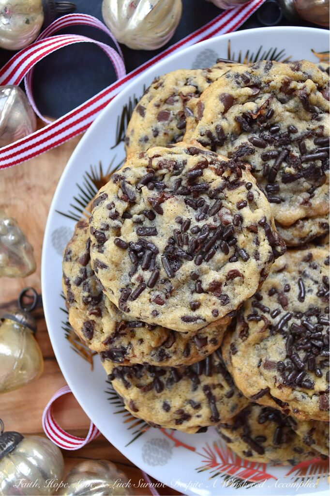 Ginger's Cherry Chocolate Chip Sprinkle Cookies - Chocolate chip cookies are everyone's favorite, and this cookie recipe is one that my mom, Ginger, would have loved at first bite. These delicious cookies are loaded with miniature semi-sweet chocolate chips, chocolate sprinkles, and dried sweetened cherries, making them the perfect combination of crunchy and chewy. If you're someone who loves chocolaty cookies with lots of texture, these are the cookies for you.