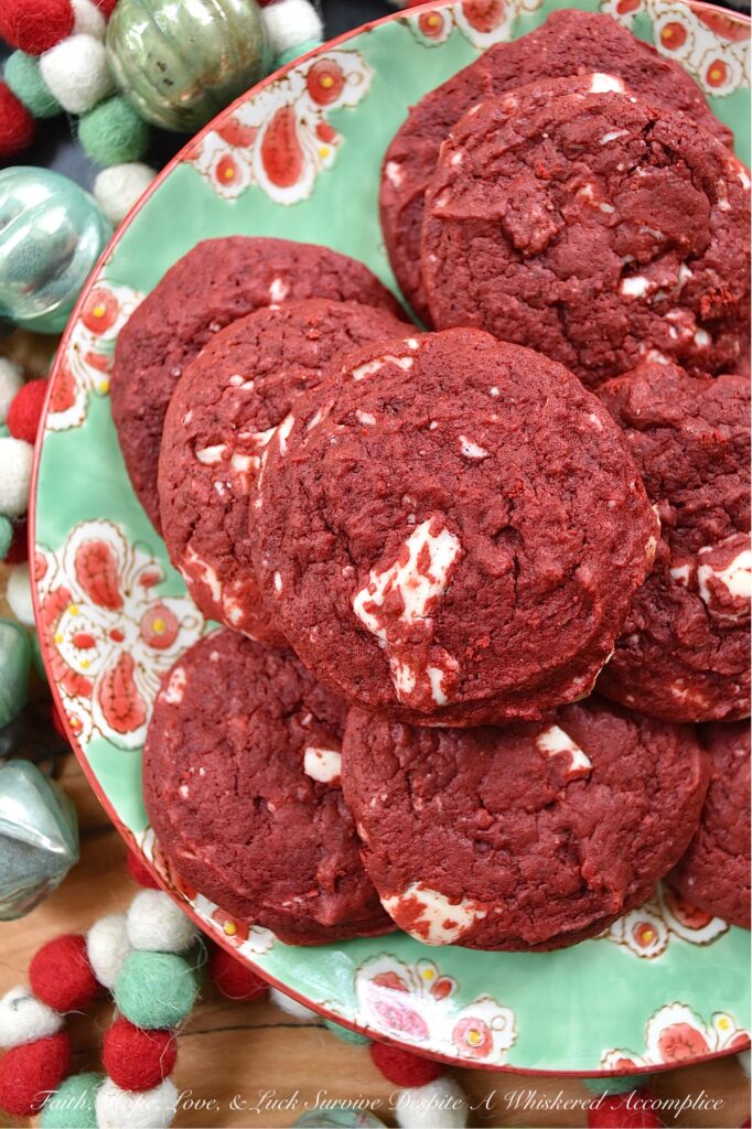 White Chocolate Red Velvet Cake Mix Cookies - Cake mix cookies are a delicious way to enjoy a sweet treat without having to spend a lot of time in the kitchen. These red velvet cake mix cookies are soft, cakey, and absolutely delicious. Plus, the addition of chopped white chocolate to the cookie dough gives these vibrant red velvet cookies a festive red-and-white color combination that's perfect for the holidays.