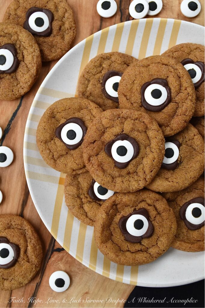 Cinnamon Sugar Pumpkin Cyclops Cookies - These soft, chewy pumpkin Cyclops cookies with a crunchy cinnamon sugar coating are a spooky and adorable treat that everyone will love. They are made with canned pumpkin and a generous amount of ground cinnamon, giving them a unique flavor that is perfect for the spookiest season of the year. These cookies are sure to bring a smile to everyone who tries them. But beware, these cookies are so good that they'll disappear in a blink of an eye.
