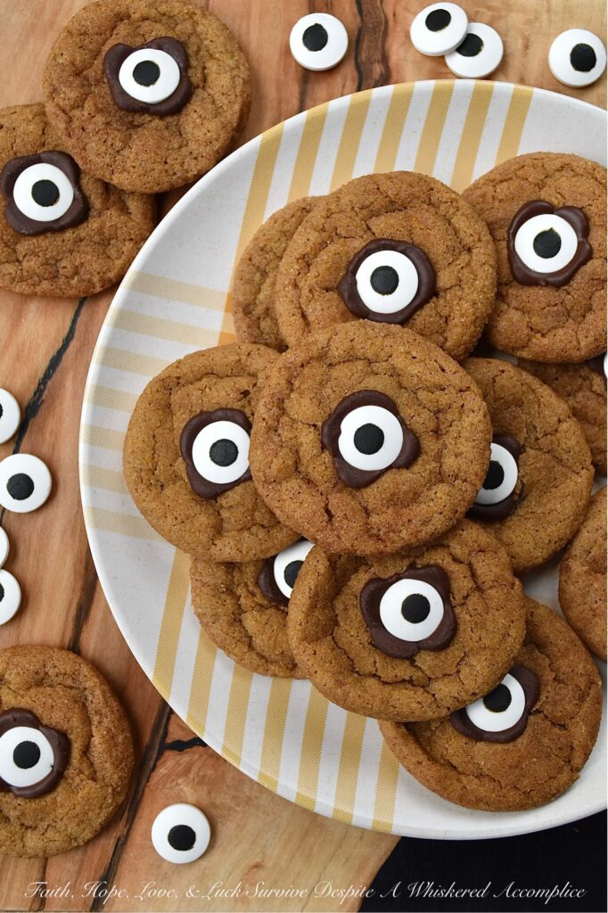 Cinnamon Sugar Pumpkin Cyclops Cookies - These soft, chewy pumpkin Cyclops cookies with a crunchy cinnamon sugar coating are a spooky and adorable treat that everyone will love. They are made with canned pumpkin and a generous amount of ground cinnamon, giving them a unique flavor that is perfect for the spookiest season of the year. These cookies are sure to bring a smile to everyone who tries them. But beware, these cookies are so good that they'll disappear in a blink of an eye.