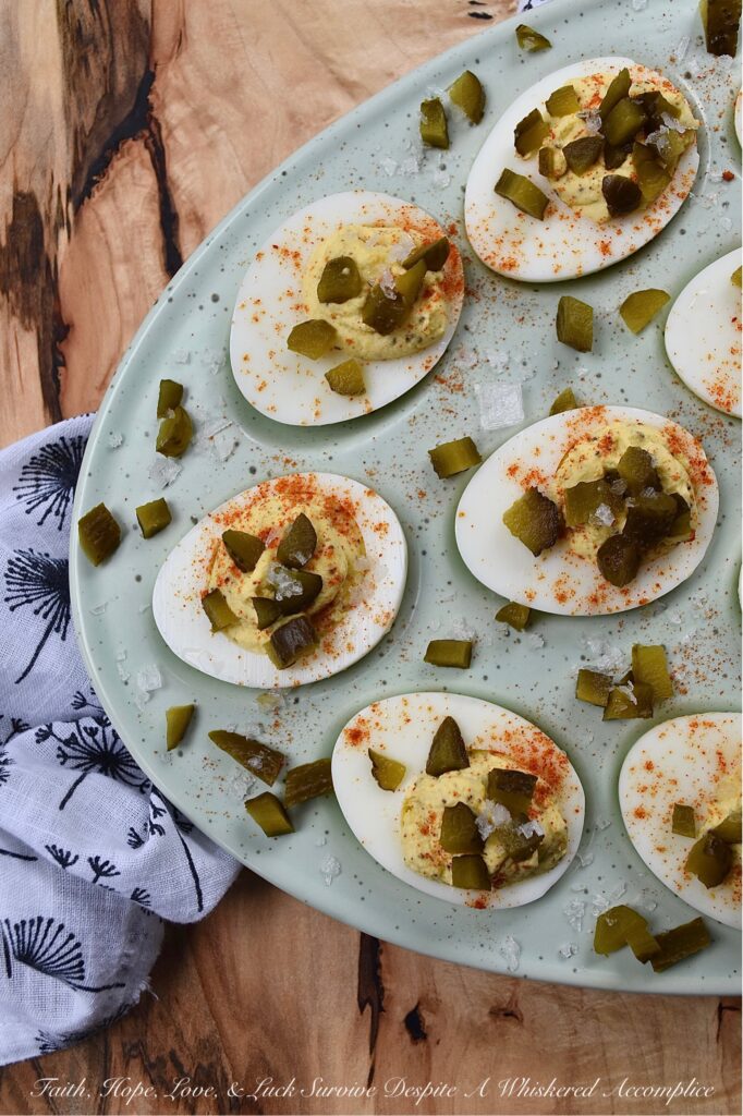 Southern Sweet Pickle Deviled Eggs - Southern sweet pickle deviled eggs are a great choice for any occasion, whether you're in need of a quick snack, a side dish, or perhaps an appetizer to start off a meal. The combination of mayonnaise, pickle juice, and dry mustard creates a tangy and savory flavor that is perfectly balanced with a touch of sweetness. And, the garnish of diced sweet pickle, paprika, and flaky sea salt adds just the right hint of flavorful salty sweetness to make these deviled eggs absolutely irresistible.