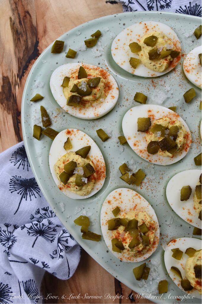 Southern Sweet Pickle Deviled Eggs - Southern sweet pickle deviled eggs are a great choice for any occasion, whether you're in need of a quick snack, a side dish, or perhaps an appetizer to start off a meal. The combination of mayonnaise, pickle juice, and dry mustard creates a tangy and savory flavor that is perfectly balanced with a touch of sweetness. And, the garnish of diced sweet pickle, paprika, and flaky sea salt adds just the right hint of flavorful salty sweetness to make these deviled eggs absolutely irresistible.