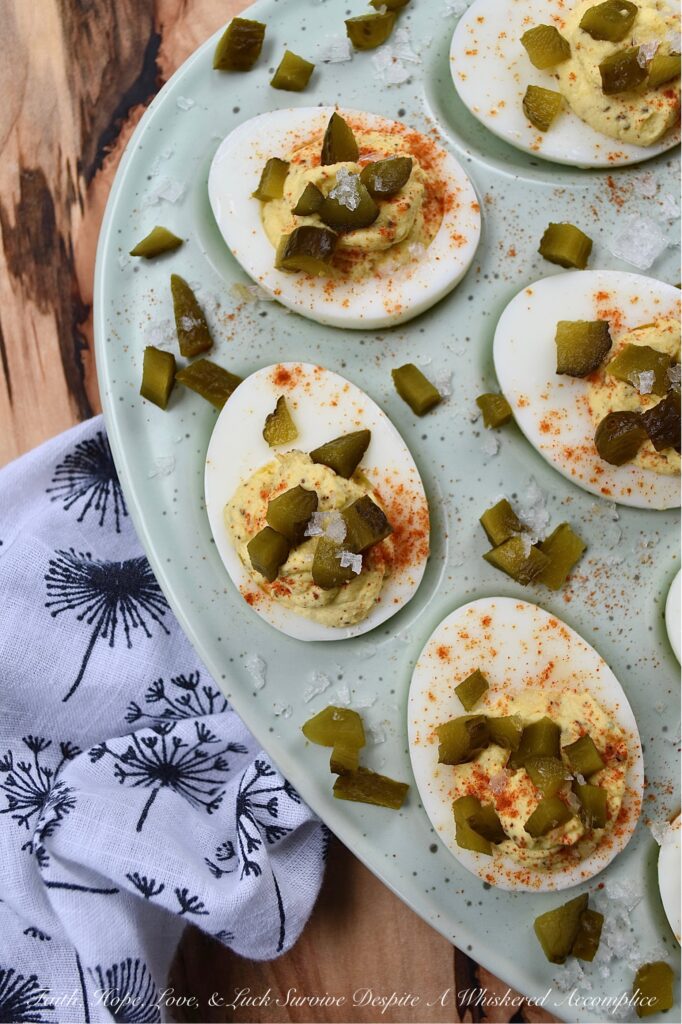 Southern Sweet Pickle Deviled Eggs - Southern sweet pickle deviled eggs are a great choice for any occasion, whether you're in need of a quick snack, a side dish, or perhaps an appetizer to start off a meal. The combination of mayonnaise, pickle juice, and dry mustard creates a tangy and savory flavor that is perfectly balanced with a touch of sweetness. And, the garnish of diced sweet pickle, paprika, and flaky sea salt adds just the right hint of flavorful salty sweetness to make these deviled eggs absolutely irresistible.