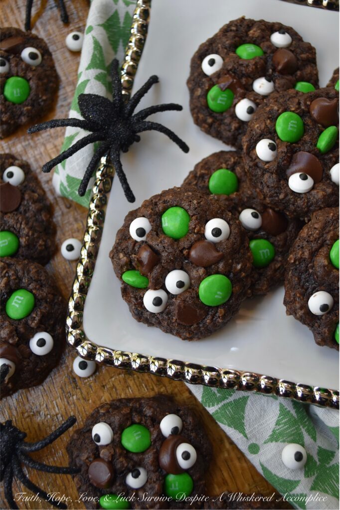Green-Eyed Monster Chocolate Oatmeal Cookies - Not only do these Green-Eyed Monster Chocolate Oatmeal Cookies look super-adorable with their candy eyeballs and green M&M’s, but they’re also loaded with dark chocolate chips for a sweet tasty chocolaty bonus. These not-so-scary chocolate oatmeal cookies are sure to delight both kids and adults alike. Serve them with a glass of cold milk for a truly festive treat.