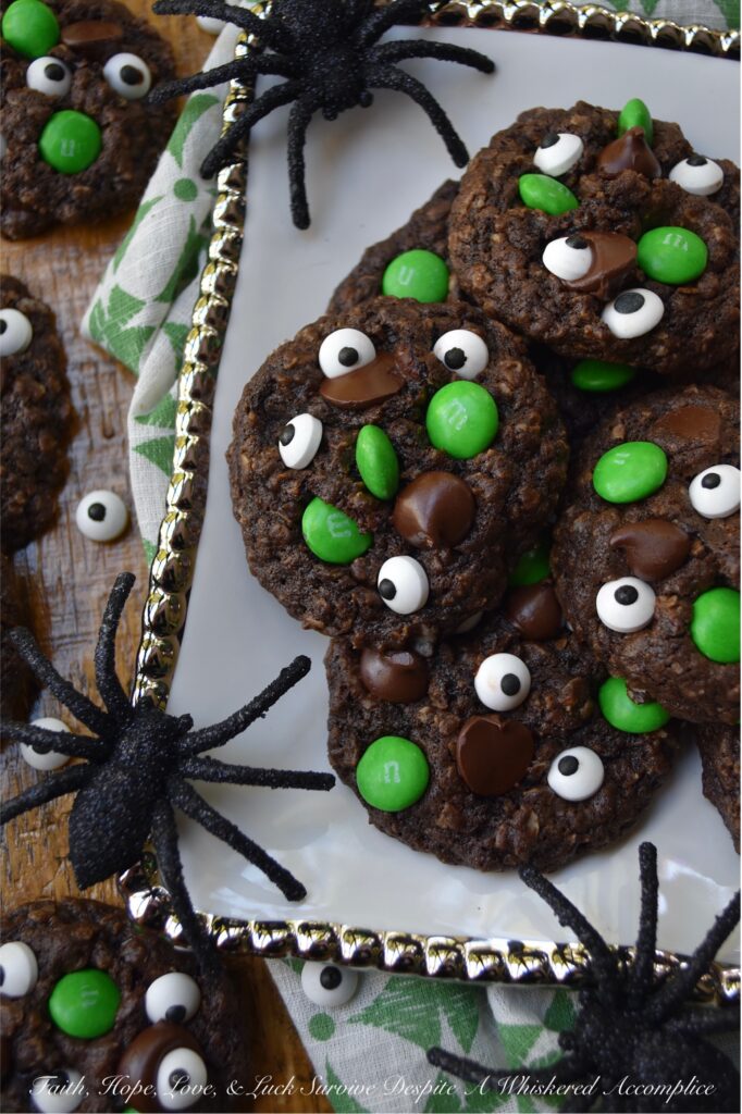 Green-Eyed Monster Chocolate Oatmeal Cookies - Not only do these Green-Eyed Monster Chocolate Oatmeal Cookies look super-adorable with their candy eyeballs and green M&M’s, but they’re also loaded with dark chocolate chips for a sweet tasty chocolaty bonus. These not-so-scary chocolate oatmeal cookies are sure to delight both kids and adults alike. Serve them with a glass of cold milk for a truly festive treat.