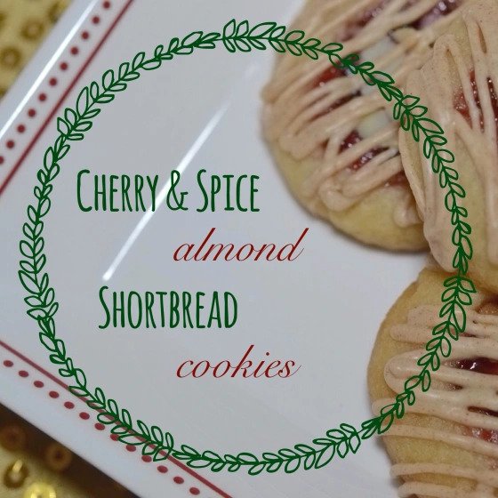 Cherry & Spice Almond Shortbread Cookies - With their combination of sweet cherry preserves, crunchy almonds, and cinnamon-flavored white chocolate drizzle, these buttery thumbprint cookies are the perfect holiday cookie. Whether you're baking for a special occasion or just making some treats to enjoy during the holiday season, festive, fruity, buttery, nutty holiday cookies are a great way to add some holiday cheer to your cookie tray.