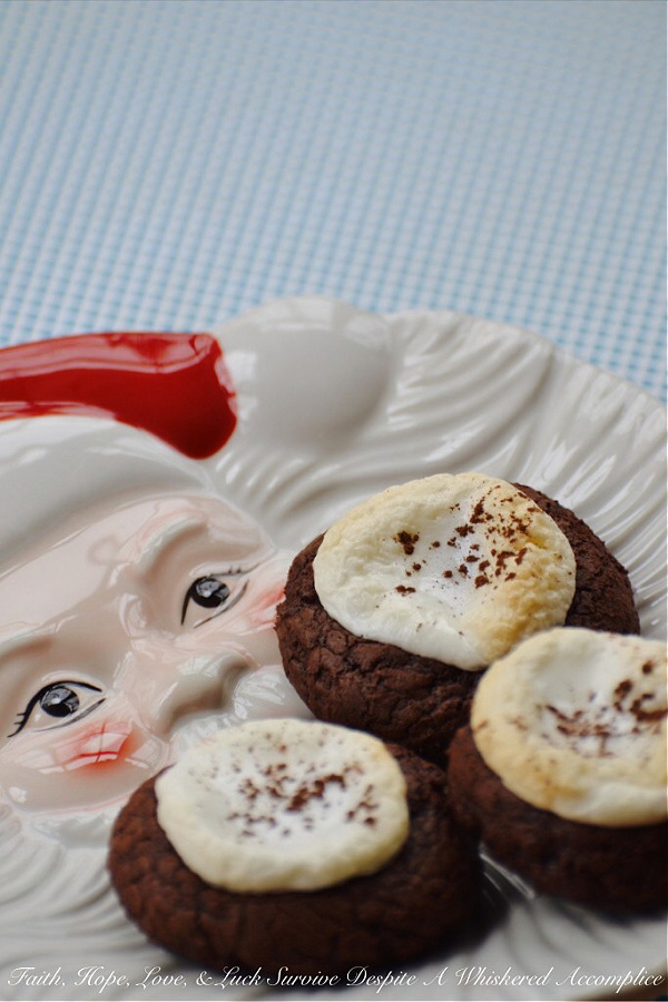 Hot Chocolate Brownie Cookies - When it comes to winter treats, it can be hard to choose between hot chocolate, brownies, and cookies. But why choose when you can have all three in one cookie? These delicious cookies have a lovely brownie texture, are bursting with chocolaty goodness, and are topped with melted marshmallows just like the best hot chocolate. They're the perfect cookie to celebrate a snow day with.