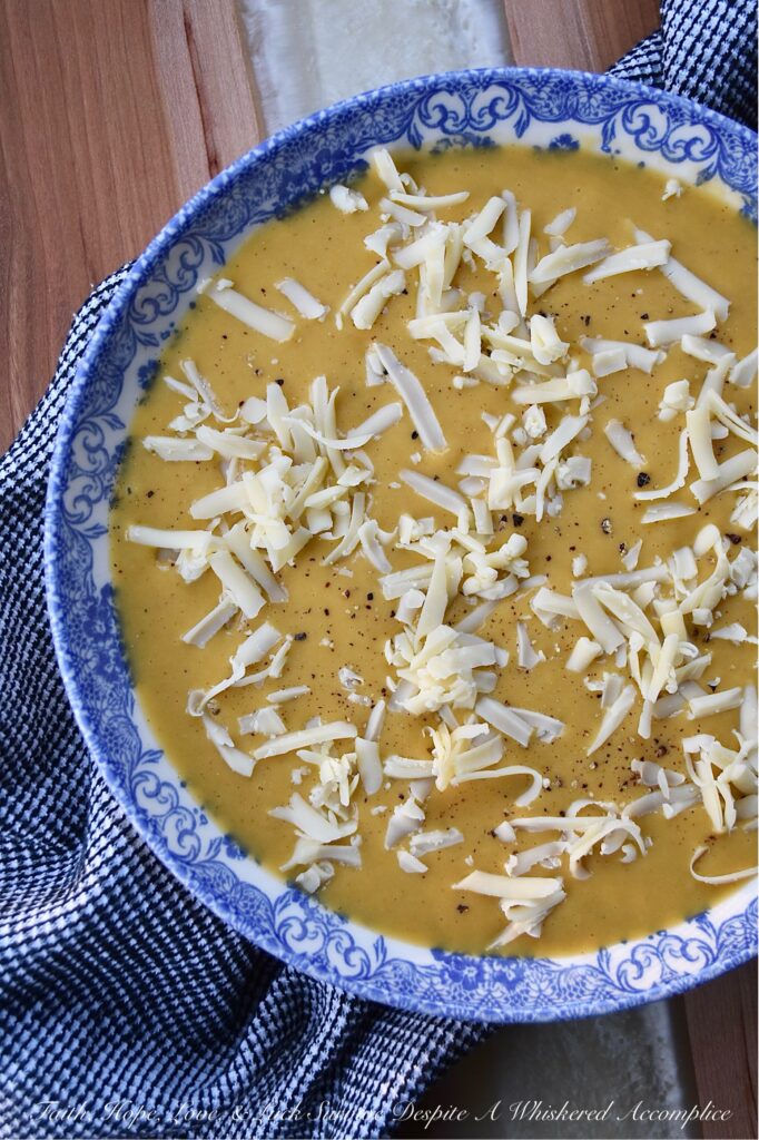 Creamy Autumn Harvest Cider Sweet Potato Soup - This creamy sweet potato soup is the perfect fall harvest recipe to enjoy on a busy weeknight or activity-loaded weekend. Sweet potatoes, celery, apple cider, and ground sage combine to create a warm, slightly sweet, comforting autumn flavor that's sure to be an instant hit. Top each bowl with a generous sprinkle of gouda cheese for an extra touch of richness and you have the perfect easy-to-make meal to enjoy on any crisp fall evening.