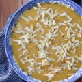 Creamy Autumn Harvest Cider Sweet Potato Soup - This creamy sweet potato soup is the perfect fall harvest recipe to enjoy on a busy weeknight or activity-loaded weekend. Sweet potatoes, celery, apple cider, and ground sage combine to create a warm, slightly sweet, comforting autumn flavor that's sure to be an instant hit. Top each bowl with a generous sprinkle of gouda cheese for an extra touch of richness and you have the perfect easy-to-make meal to enjoy on any crisp fall evening.