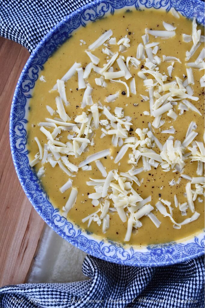 Creamy Autumn Harvest Cider Sweet Potato Soup - This creamy sweet potato soup is the perfect fall harvest recipe to enjoy on a busy weeknight or activity-loaded weekend. Sweet potatoes, celery, apple cider, and ground sage combine to create a warm, slightly sweet, comforting autumn flavor that's sure to be an instant hit. Top each bowl with a generous sprinkle of gouda cheese for an extra touch of richness and you have the perfect easy-to-make meal to enjoy on any crisp fall evening.