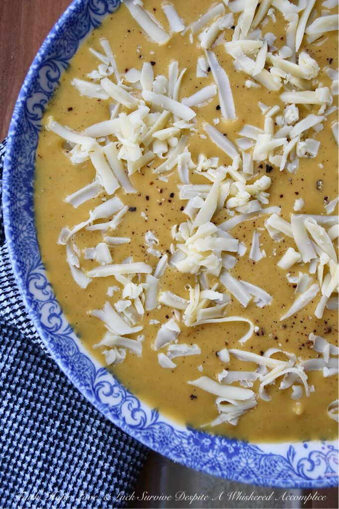 Creamy Autumn Harvest Cider Sweet Potato Soup - This creamy sweet potato soup is the perfect fall harvest recipe to enjoy on a busy weeknight or activity-loaded weekend. Sweet potatoes, celery, apple cider, and ground sage combine to create a warm, slightly sweet, comforting autumn flavor that's sure to be an instant hit. Top each bowl with a generous sprinkle of gouda cheese for an extra touch of richness and you have the perfect easy-to-make meal to enjoy on any crisp fall evening.