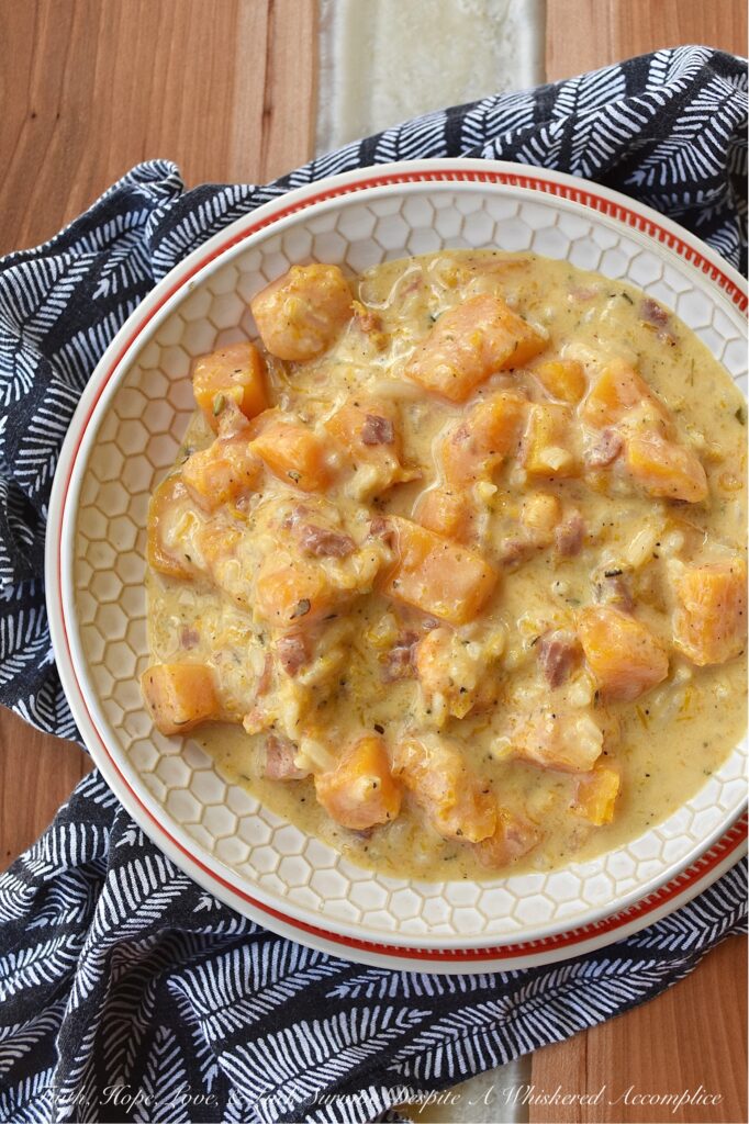 Creamy Prosciutto & Butternut Squash Rice Soup - This easy-to-make one-pot soup is a great option for a quick weeknight meal. Made with Herbes de Provence, diced butternut squash, and salty prosciutto, this soup is almost sure to please with its creamy, rich, decadent flavor. Serve this delicious soup with a crusty piece of bread for a warm, comforting, satisfying cold-weather meal.