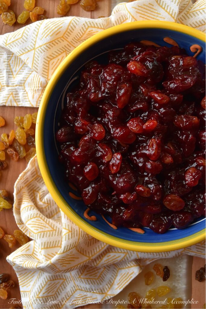 Rum Raisin Whole Berry Cranberry Sauce - This homemade whole berry cranberry sauce is the perfect holiday side dish. Made with fresh cranberries, golden raisins, spiced rum, granulated sugar, light brown sugar, and a touch of cinnamon, sea salt, and vanilla, this rum-raisin-flavored cranberry sauce adds a special touch to any holiday meal. The tartness of the cranberries, the sweetness of the sugars, and the spiciness of the rum all come together to make a delicious and unique cranberry sauce that will be a hit with your holiday guests.