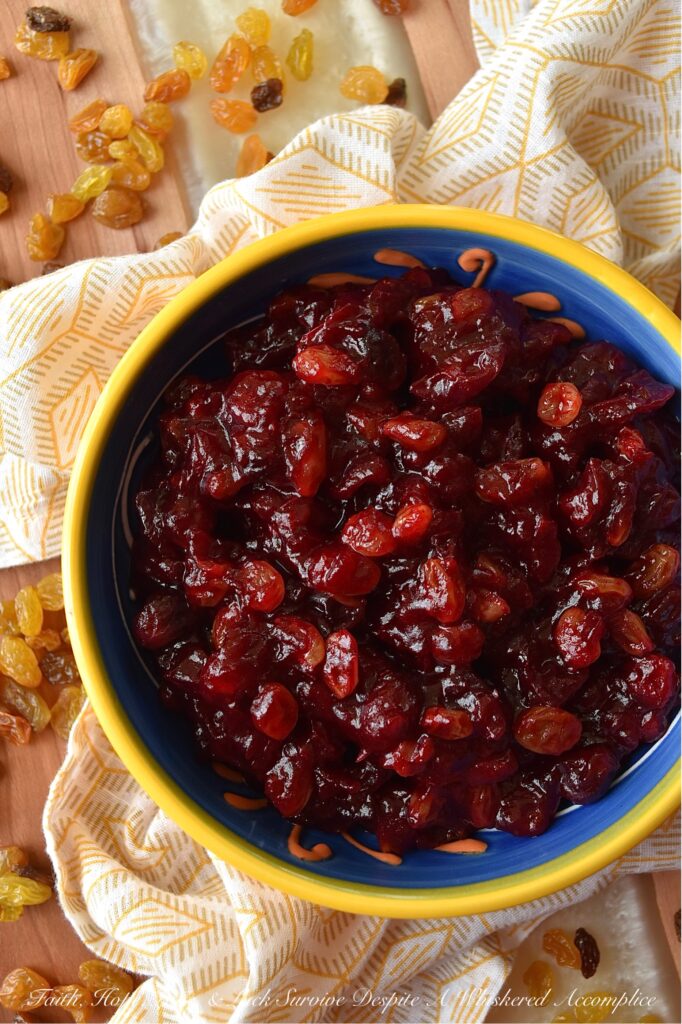 Rum Raisin Whole Berry Cranberry Sauce - This homemade whole berry cranberry sauce is the perfect holiday side dish. Made with fresh cranberries, golden raisins, spiced rum, granulated sugar, light brown sugar, and a touch of cinnamon, sea salt, and vanilla, this rum-raisin-flavored cranberry sauce adds a special touch to any holiday meal. The tartness of the cranberries, the sweetness of the sugars, and the spiciness of the rum all come together to make a delicious and unique cranberry sauce that will be a hit with your holiday guests.