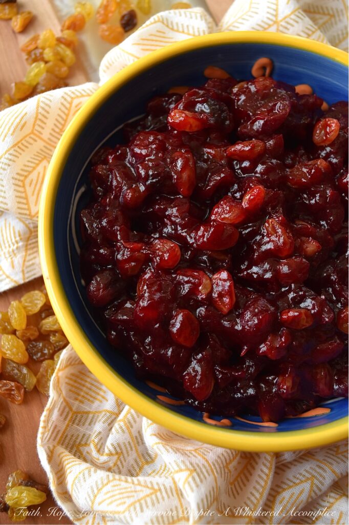 Rum Raisin Whole Berry Cranberry Sauce - This homemade whole berry cranberry sauce is the perfect holiday side dish. Made with fresh cranberries, golden raisins, spiced rum, granulated sugar, light brown sugar, and a touch of cinnamon, sea salt, and vanilla, this rum-raisin-flavored cranberry sauce adds a special touch to any holiday meal. The tartness of the cranberries, the sweetness of the sugars, and the spiciness of the rum all come together to make a delicious and unique cranberry sauce that will be a hit with your holiday guests.