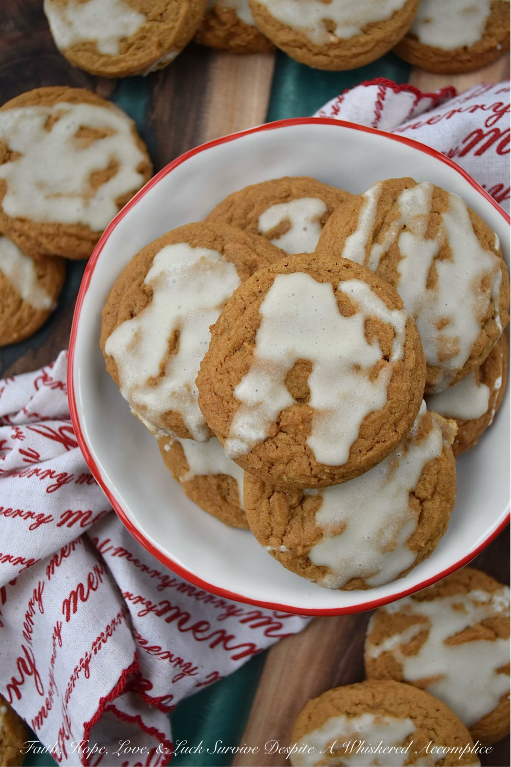 Iced Eggnog Chewy Spice Cookies - These delicious holiday cookies are spiced with ginger, cinnamon, nutmeg, and cloves for a festive flavor. To make them even better, they are topped with a delicious eggnog powdered sugar icing. With the combination of spices and sweet eggnog icing, these iced eggnog chewy spice cookies are sure to please.