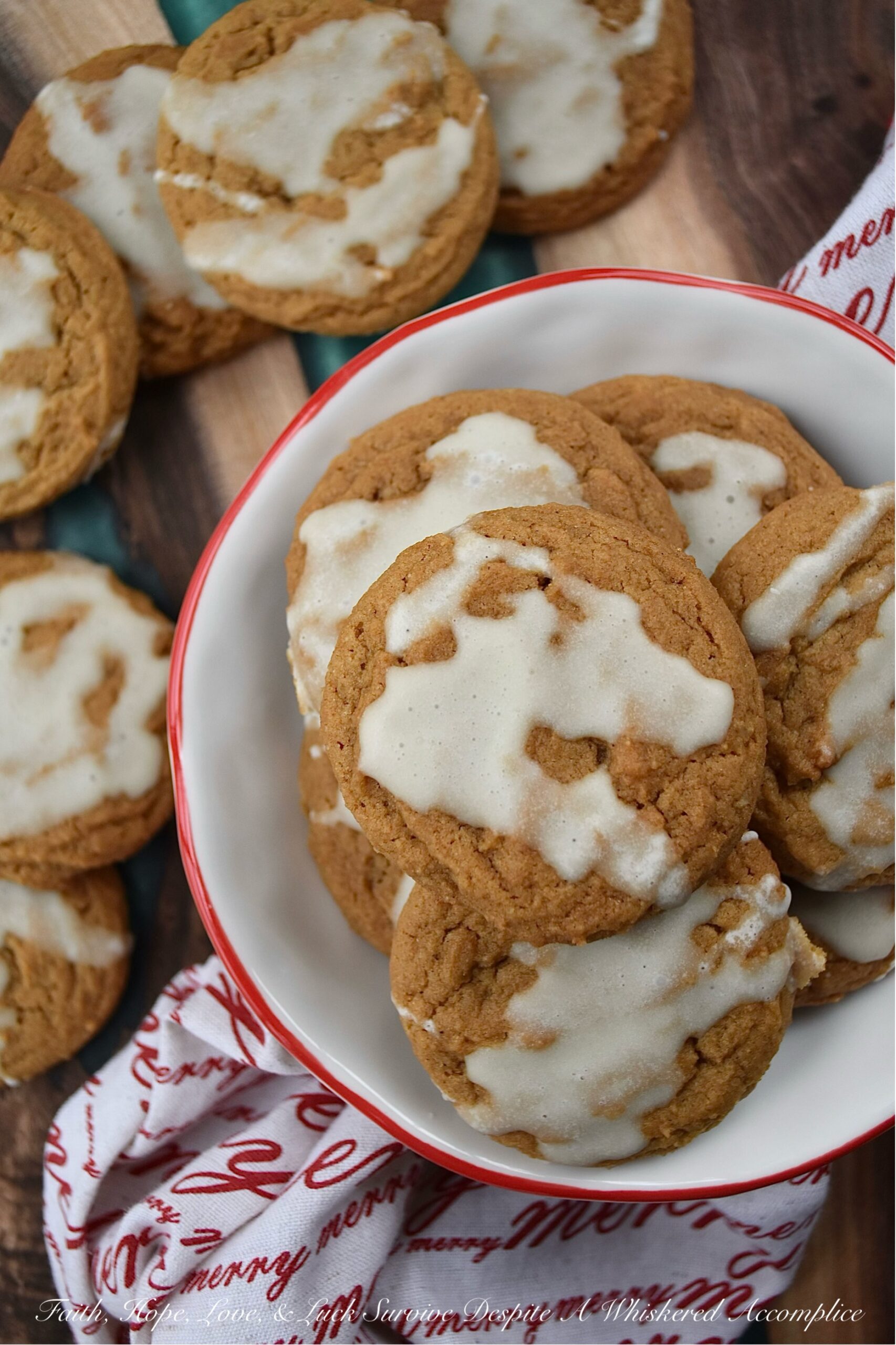 Iced Eggnog Chewy Spice Cookies - These delicious holiday cookies are spiced with ginger, cinnamon, nutmeg, and cloves for a festive flavor. To make them even better, they are topped with a delicious eggnog powdered sugar icing. With the combination of spices and sweet eggnog icing, these iced eggnog chewy spice cookies are sure to please.