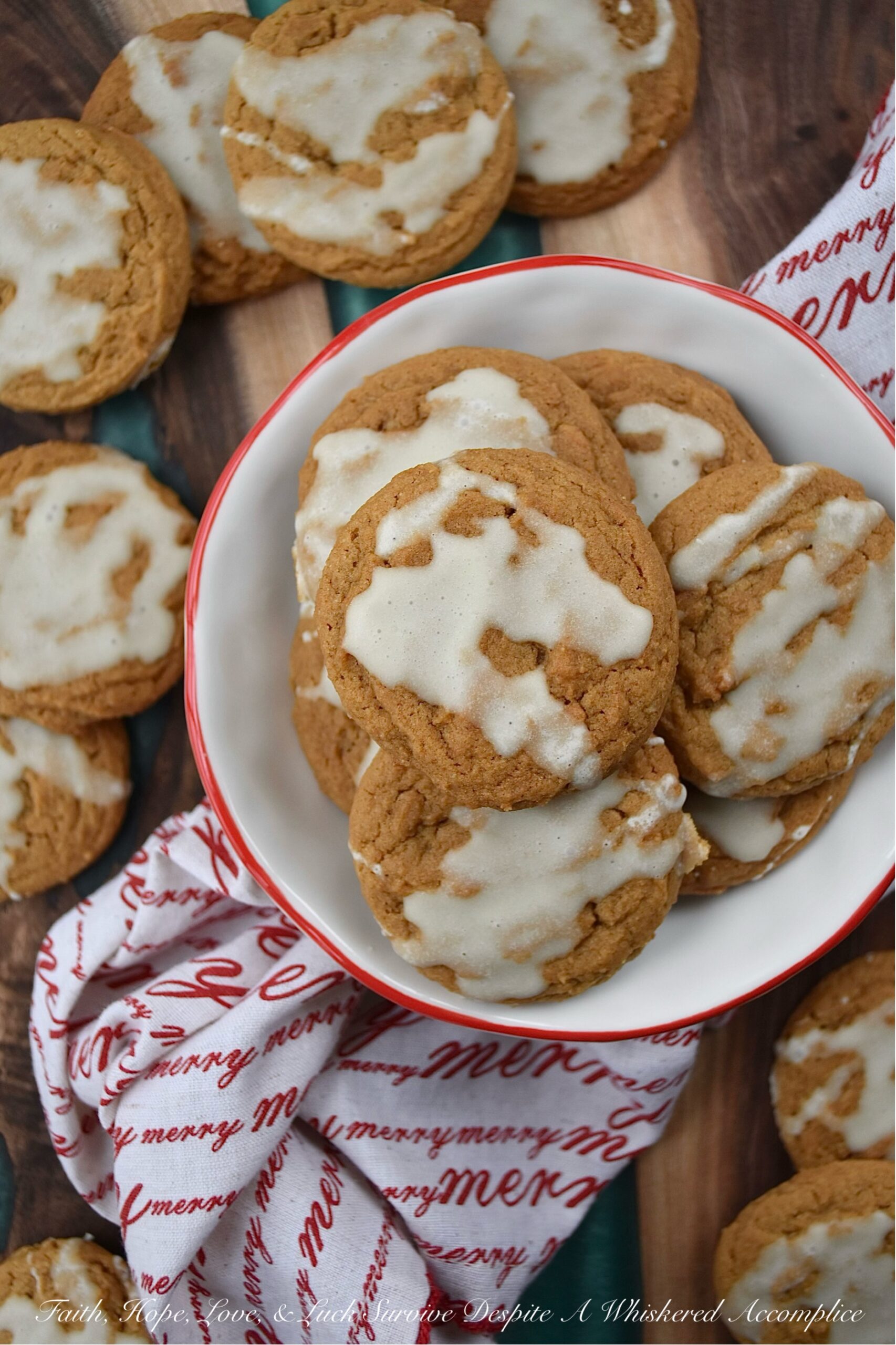 Iced Eggnog Chewy Spice Cookies - These delicious holiday cookies are spiced with ginger, cinnamon, nutmeg, and cloves for a festive flavor. To make them even better, they are topped with a delicious eggnog powdered sugar icing. With the combination of spices and sweet eggnog icing, these iced eggnog chewy spice cookies are sure to please.