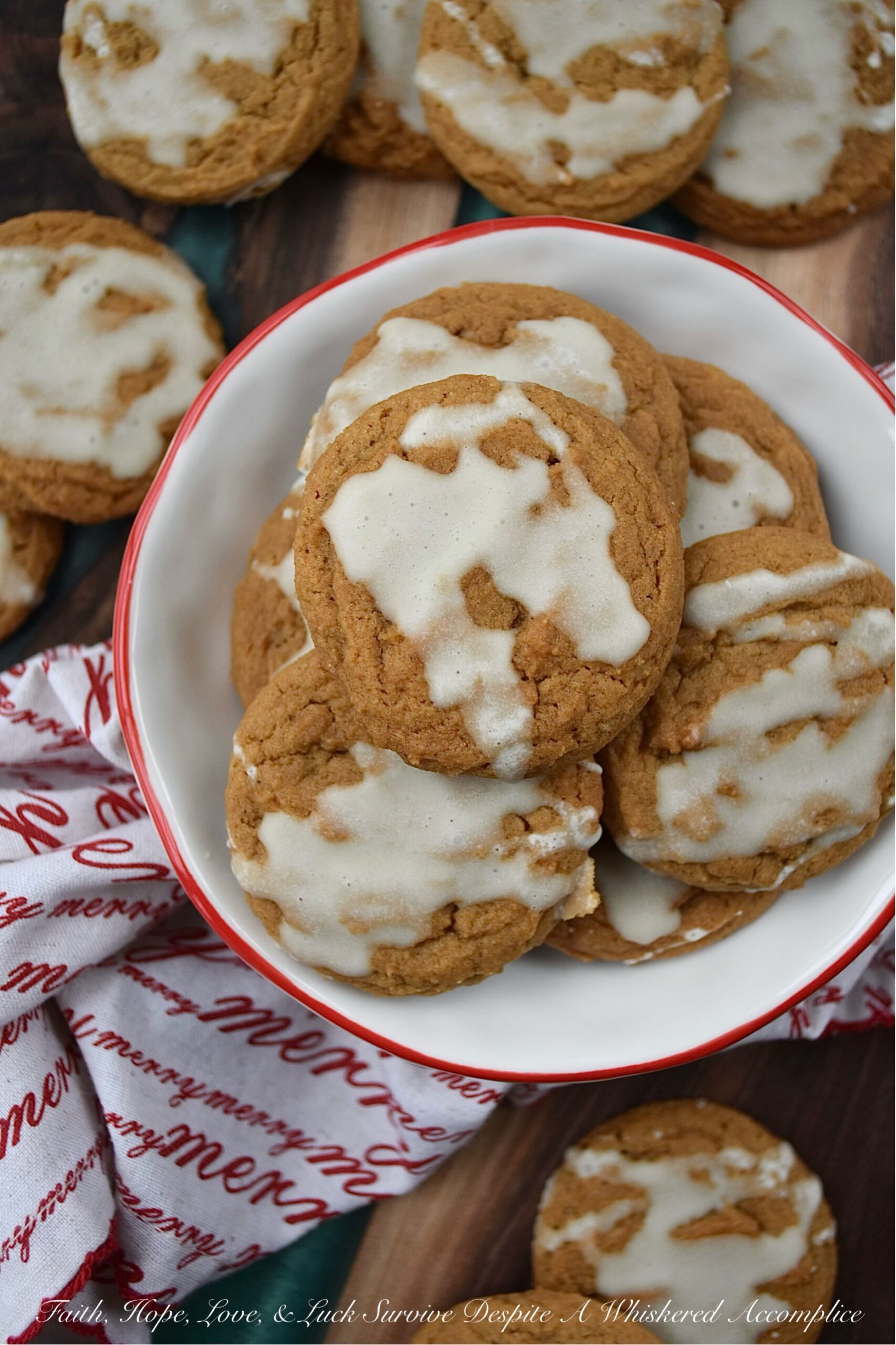 Iced Eggnog Chewy Spice Cookies - These delicious holiday cookies are spiced with ginger, cinnamon, nutmeg, and cloves for a festive flavor. To make them even better, they are topped with a delicious eggnog powdered sugar icing. With the combination of spices and sweet eggnog icing, these iced eggnog chewy spice cookies are sure to please.