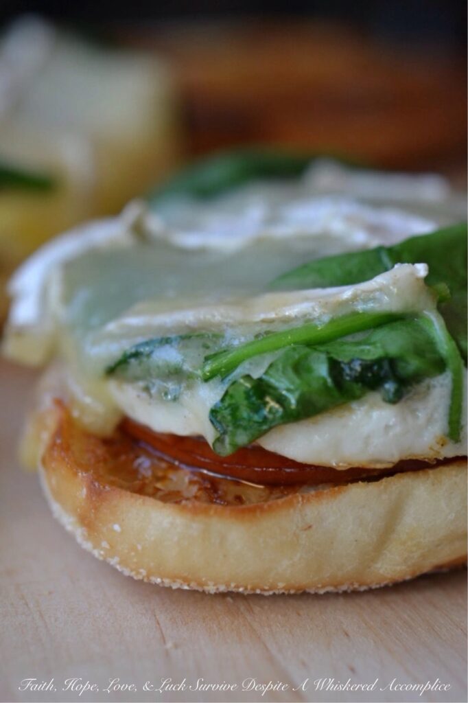 Fig and Brie Breakfast Sandwiches - This is no ordinary bacon, egg, and cheese sandwich recipe, these sandwiches take things to a whole new level. It all starts with perfectly toasted English muffins, slathered with a generous amount of fig jam or preserves. Next comes Canadian bacon, perfectly fried eggs, a handful of fresh spinach leaves, and a generous amount of melted brie cheese. This is the type of sandwich you won't mind waking up early for.