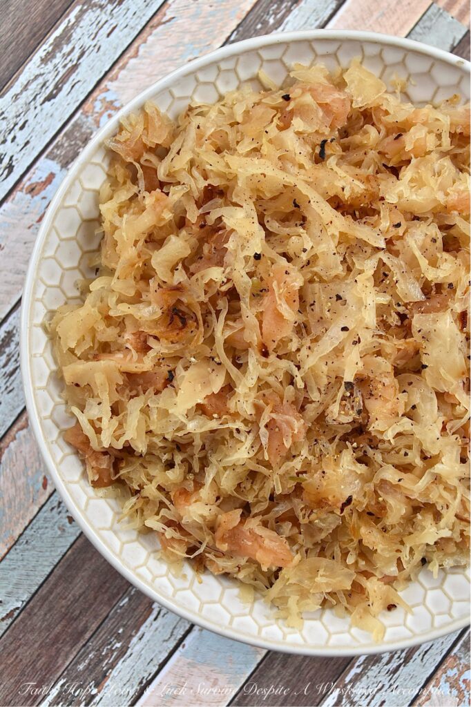Dried Apple & Bourbon Oven-Baked Sauerkraut - This Dried Apple & Bourbon Oven-Baked Sauerkraut is a simple yet delicious side dish that combines the tanginess of sauerkraut with the sweetness of dried apples and brown sugar plus the bold and smoky flavor of bourbon. It's the perfect side dish to add some variety to your meals and is sure to be a crowd-pleaser for any game day, cookout, or holiday gathering. If you're looking for a new way to enjoy sauerkraut, be prepared to be blown away by this delicious sweet and tangy version.
