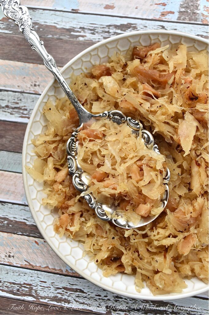 Dried Apple & Bourbon Oven-Baked Sauerkraut - This Dried Apple & Bourbon Oven-Baked Sauerkraut is a simple yet delicious side dish that combines the tanginess of sauerkraut with the sweetness of dried apples and brown sugar plus the bold and smoky flavor of bourbon. It's the perfect side dish to add some variety to your meals and is sure to be a crowd-pleaser for any game day, cookout, or holiday gathering. If you're looking for a new way to enjoy sauerkraut, be prepared to be blown away by this delicious sweet and tangy version.