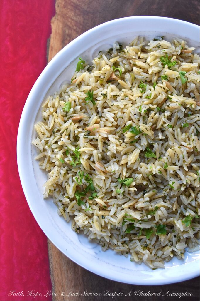 Buttery Weeknight Rice Pilaf with Parsley - Say goodbye to boring rice and hello to a mouthwatering side dish that will become a new family favorite. This buttery rice pilaf is loaded with fresh parsley and pairs well with almost any meal. Whether eaten on its own or served alongside your favorite main dish, this easy weeknight recipe is guaranteed to please even the pickiest of eaters.