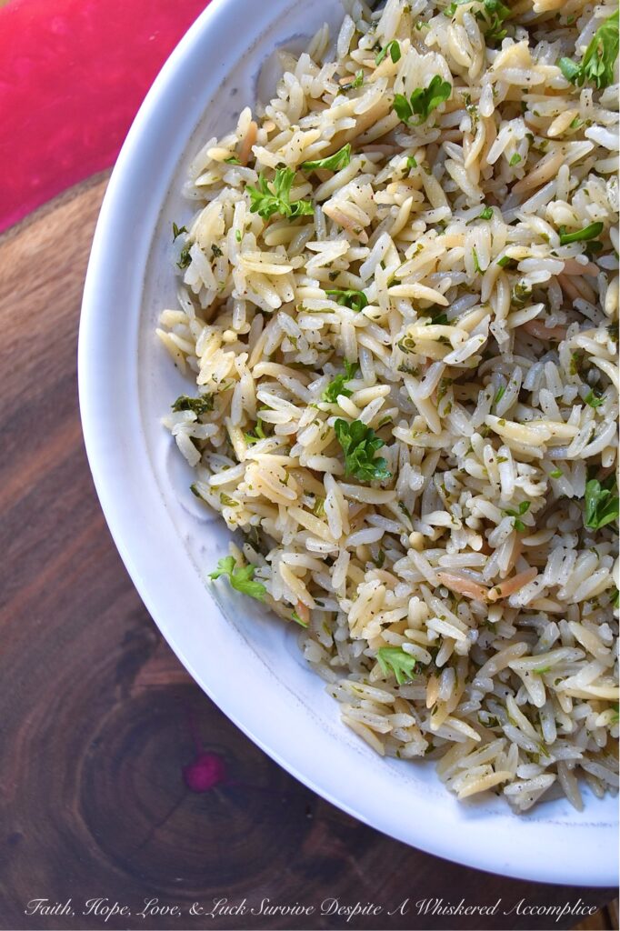 Buttery Weeknight Rice Pilaf with Parsley - Say goodbye to boring rice and hello to a mouthwatering side dish that will become a new family favorite. This buttery rice pilaf is loaded with fresh parsley and pairs well with almost any meal. Whether eaten on its own or served alongside your favorite main dish, this easy weeknight recipe is guaranteed to please even the pickiest of eaters.