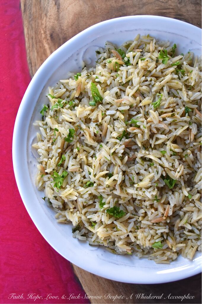 Buttery Weeknight Rice Pilaf with Parsley - Say goodbye to boring rice and hello to a mouthwatering side dish that will become a new family favorite. This buttery rice pilaf is loaded with fresh parsley and pairs well with almost any meal. Whether eaten on its own or served alongside your favorite main dish, this easy weeknight recipe is guaranteed to please even the pickiest of eaters.