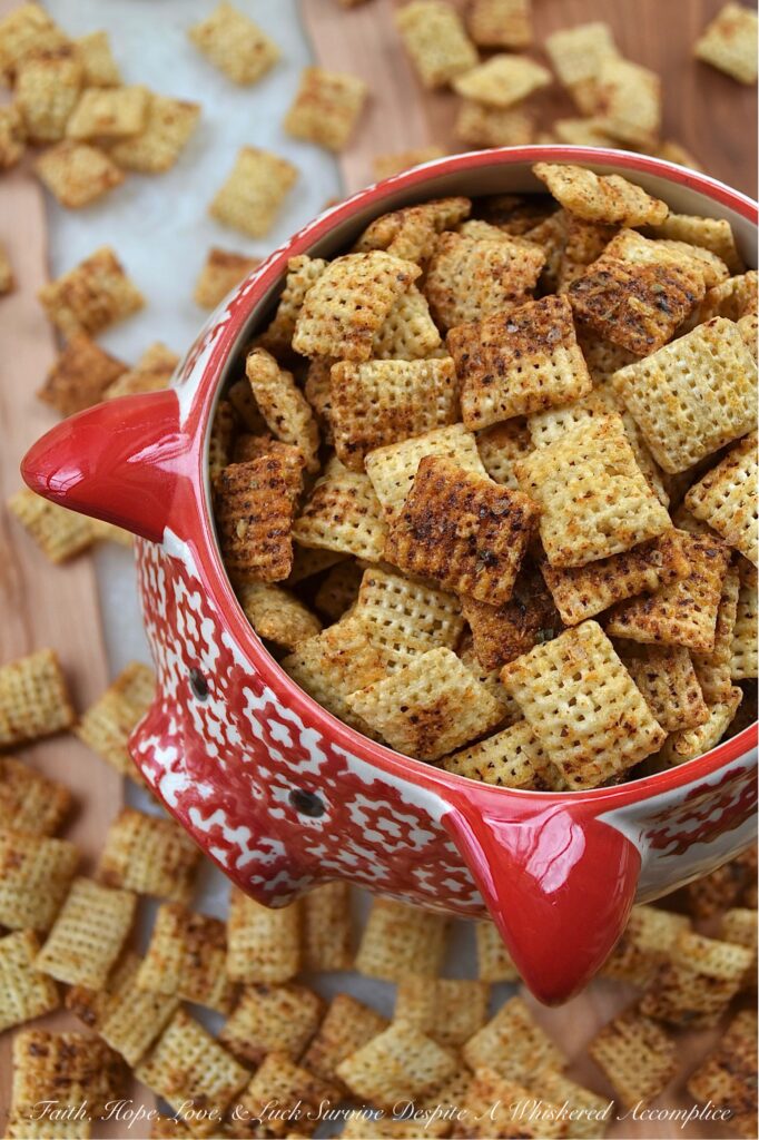 Spicy Barbecue Seasoned Rice Chex Mix - Packed with a combination of slightly spicy barbecue herbs and spices, and a touch of brown sugar sweetness, this crunchy homemade rice chex mix will have you reaching for another handful before you even finish the first. Its perfect balance of spicy, sweet, and barbecue flavors, along with its satisfying crunch, make this snack mix a real crowd-pleaser for almost any party, game day, or event.