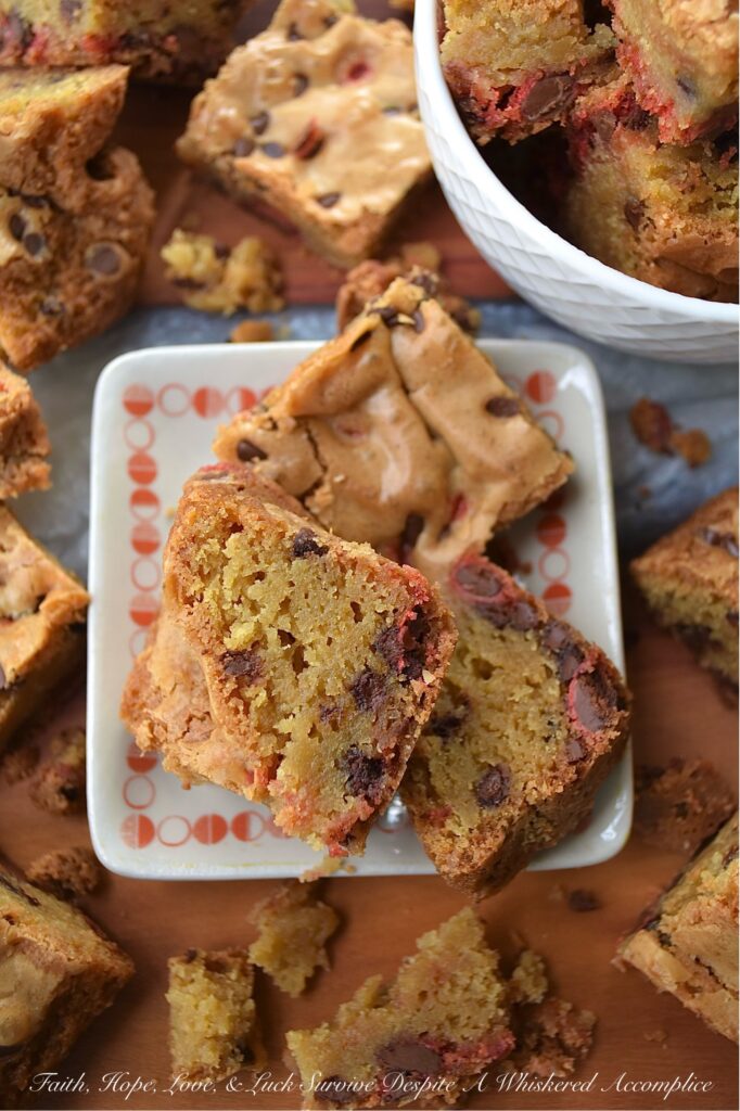 Chocolate Chip Cookie Blondies with M&M's - Get ready to satisfy your sweet tooth with these irresistible chocolate chip cookie blondies. These delicious bar cookies are the perfect sweet treat, boasting a soft and gooey center with thick, baked crunchy edges. And, since these blondies are so easy to customize with seasonal M&M's, they're an excellent festive dessert option for almost any occasion.