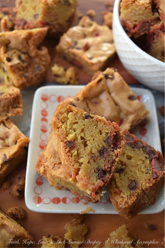 Chocolate Chip Cookie Blondies with M&M's - Get ready to satisfy your sweet tooth with these irresistible chocolate chip cookie blondies. These delicious bar cookies are the perfect sweet treat, boasting a soft and gooey center with thick, baked crunchy edges. And, since these blondies are so easy to customize with seasonal M&M's, they're an excellent festive dessert option for almost any occasion.