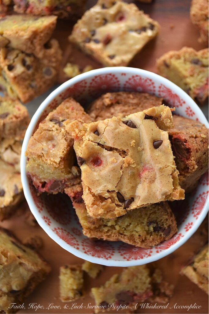 Chocolate Chip Cookie Blondies with M&M's - Get ready to satisfy your sweet tooth with these irresistible chocolate chip cookie blondies. These delicious bar cookies are the perfect sweet treat, boasting a soft and gooey center with thick, baked crunchy edges. And, since these blondies are so easy to customize with seasonal M&M's, they're an excellent festive dessert option for almost any occasion.