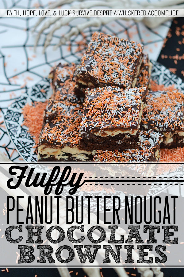 Fluffy Peanut Butter Nougat Chocolate Brownies - These moist and decadent brownies are topped with fluffy peanut butter nougat and peanuts, before being spread with a thick heavenly chocolate icing.