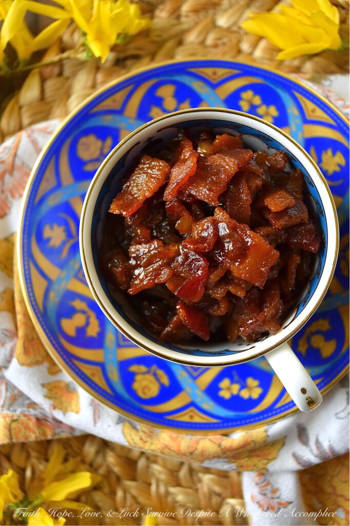 Bourbon & Onion Bacon Jam - This mouthwatering condiment combines the rich saltiness of bacon with the sweetness of yellow onions, smoky chili powder, and a touch of maple syrup and brown sugar. A splash of apple cider vinegar and a hint of bourbon also add a delightful tang and boozy kick to this delectable bacon jam. Whether used as a sandwich spread, mixed with cream cheese for a cracker topping, or even as a unique addition to deviled eggs, this irresistible Bourbon & Onion Bacon jam is guaranteed to have you coming back for more.